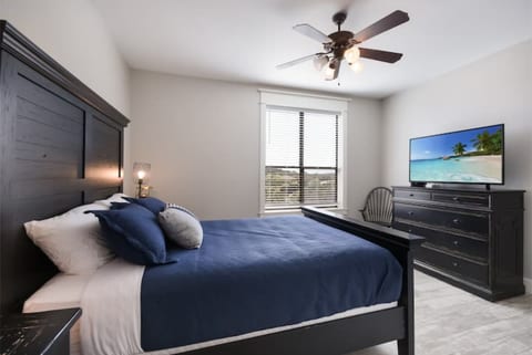 Welcoming private bedroom with a comfortable queen bed, fresh linens, bedside lighting, and thoughtful touches to help guests feel settled and at home during their Lake Travis stay