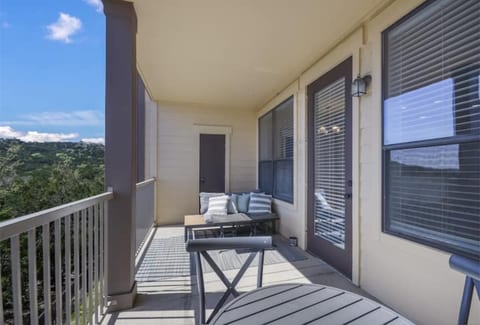 Private balcony with outdoor seating and peaceful views near Lake Travis in Jonestown, TX.