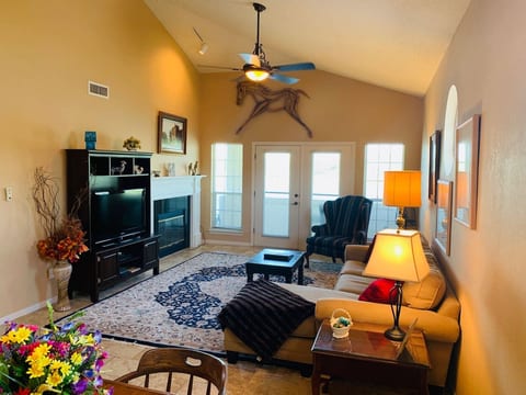 Living Area with Vaulted Ceilings & Warm Decor