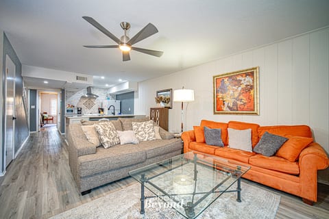 Comfortable living room with bright seating, thoughtful décor, and plenty of space to unwind together