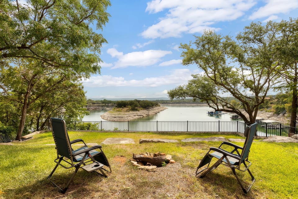 Fire pit area with a lake view