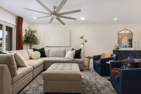 Living Room - Storage Ottoman contains extra pillows and blankets for cozy movie nights