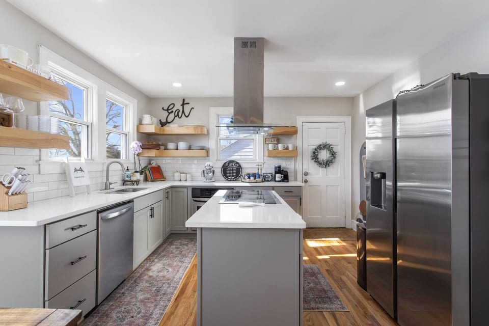 Sunlit space with sleek appliances and charming decor for great culinary experiences!