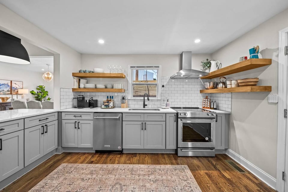 Fully equipped chef’s kitchen featuring high-end appliances and all the essentials for a gourmet meal — including KitchenAid range and mixer, Nespresso, Keurig, and an array of quality cookware and utensils.
