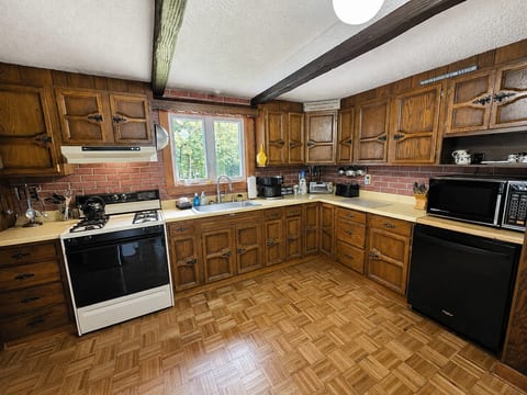 Enjoy a spacious, fully equipped kitchen with plenty of counter space for preparing meals during your stay.