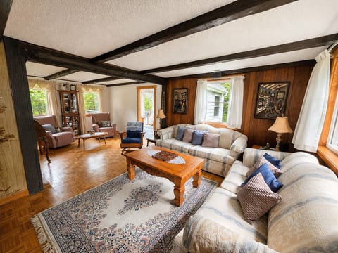 Relax in the spacious and comfortable living area, offering plenty of seating for everyone to gather and unwind.