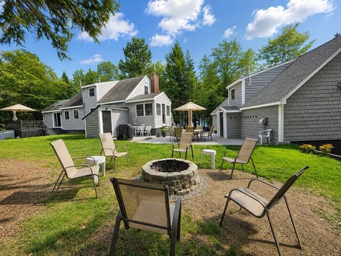 Gather around the outdoor fire pit and enjoy a relaxing evening with plenty of seating and beautiful surroundings.