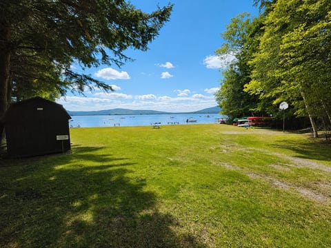 Enjoy easy lake access with a spacious grassy area, picnic tables, and beautiful waterfront views—perfect for swimming, relaxing, and enjoying the outdoors.
