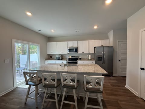 Coffee bar, microwave, toaster oven, rice maker, fridge, freezer, disposal, dishwasher, stove, oven, blackstone accessories
