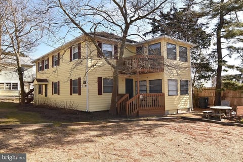 The condo is on the first floor, with a small deck outside and three steps up to entry door.