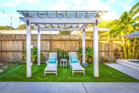 Enjoy some shade under our pergola with a ceiling fan!