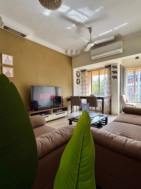 Living Room-Experience a cozy and serene living space with a 55" smart TV, Wi-Fi, curated reading materials, and warm ambient lighting throughout the home perfect for unwinding and soaking in the perfect evening vibe with the city sky line view.