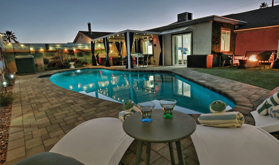 Resort-style backyard, heated pool, patio dining, loungers & fire pit. High privacy walls
