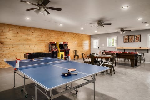 Spacious game room with ping pong, pool table, and classic arcade fun