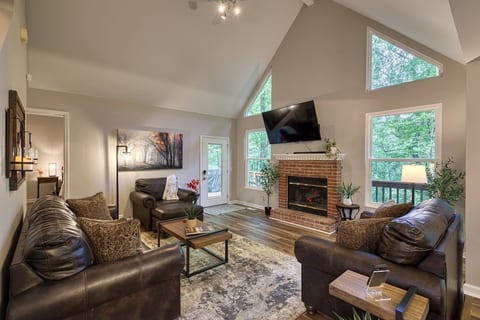 Comfy living room with electric fireplace for relaxing during the day or evening.