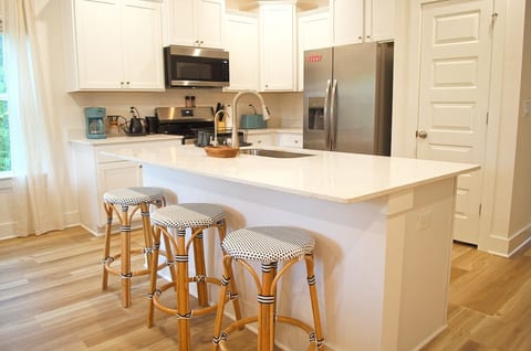 Fully stocked kitchen with cookware and sharp knives