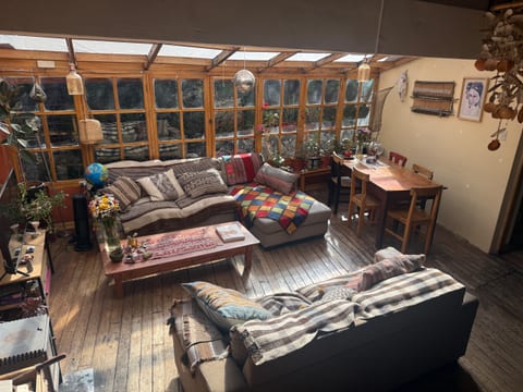 Cozy sunlit wooden chalet with plenty of greenery