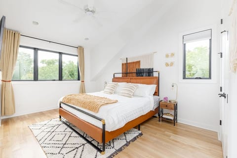 King Suite: Plush King bed, memory foam mattress, south-facing morning light, ceiling fan, blackout curtains — sleep in or wake up right on your own schedule