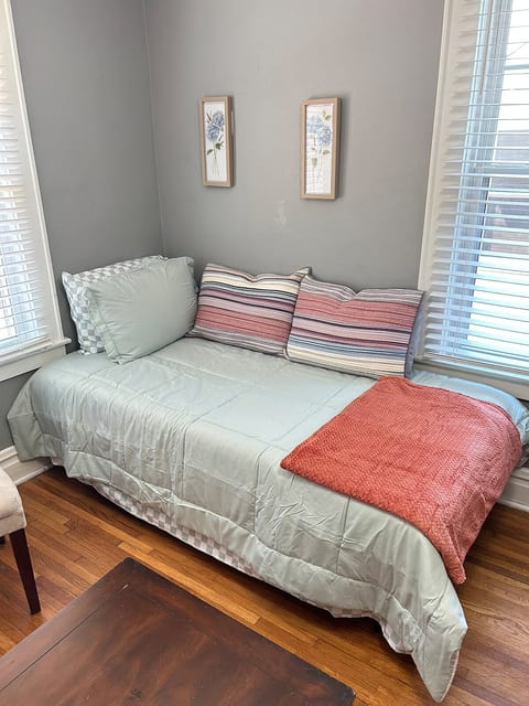 This daybed functions as seating for the main living space, or serves as a third bed/ bedroom for added options during your stay!