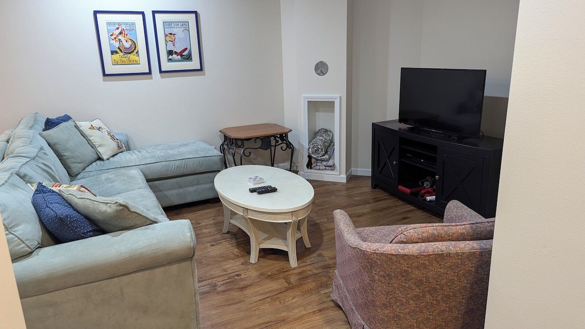 Second living area with TV  in the finished basement