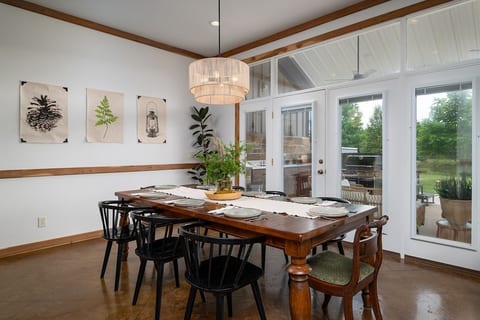 Gather, relax, and reconnect in the spacious main living area overlooking the pond.
