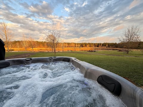 Relax in the private hot tub with peaceful pond views. Beach towels are provided, so you can unwind and enjoy the moment in comfort.