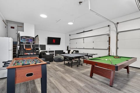 Spacious game room: pool, ping pong, hoops, foosball & big TV