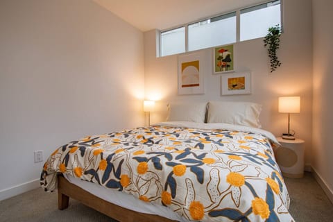 Downstairs bedroom located close to entrance with queen bed. Nice size close to hang clothes. Shared bathroom located outside of the room.