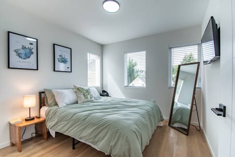 Find your sanctuary in our beautifully appointed bedroom! With a comfortable bed, an elegant mirror, and a TV, it’s the perfect spot to unwind and recharge