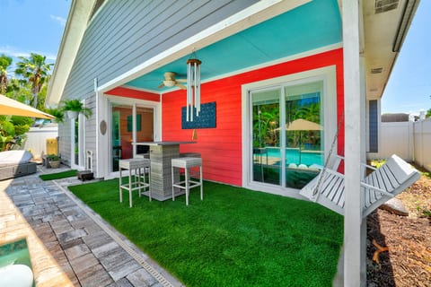 Relaxing patio area, featuring a shaded space.