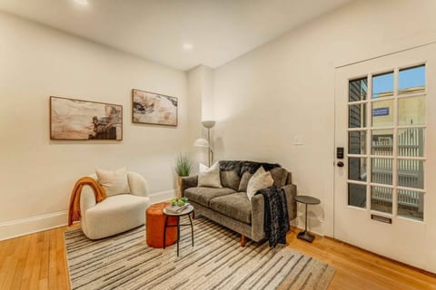 Step into this chic living room, complete with a cozy TV area, perfect for relaxing and unwinding.
