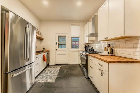 Cook with ease in this fully equipped kitchen, featuring a spacious fridge and all the essentials for your culinary needs!
