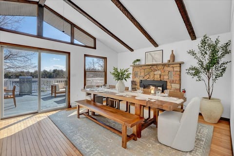 Dine in warmth and style! Enjoy cozy meals by the fireplace with breathtaking lake views as your backdrop.