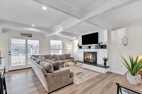 Relax in style—sink into comfy seating by the fire and enjoy your favorite show.
