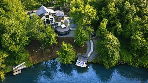 Your private waterfront retreat. From the hot tub and fire pit to the private dock, kayaks, and spacious outdoor gathering areas, every backyard amenity is designed for unforgettable moments by the lake.