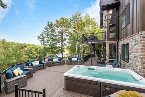 Your front-row seat to the lake. Whether you're soaking in the hot tub or lounging on the cozy outdoor furniture, this is the perfect place to relax from sunrise to sunset.