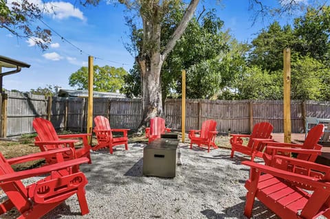 Unwind under the stars by the propane fire pit with comfy Adirondack seating.