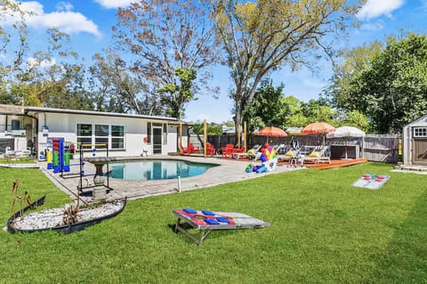 Backyard fun awaits—heated pool, fire pit, and giant games for everyone.