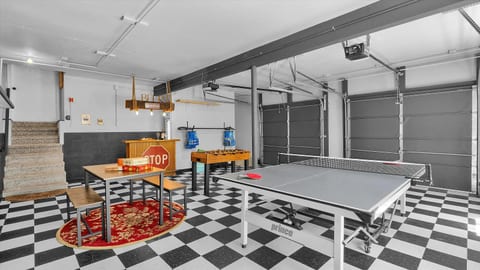 First-floor game room, converted from the garage: ping pong, foosball and a checkers table.