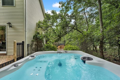Private hot tub overlooking the woods. Soak under the stars on a cool fall night.