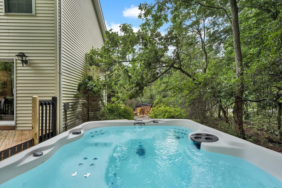 Private hot tub overlooking the woods. Soak under the stars on a cool fall night.