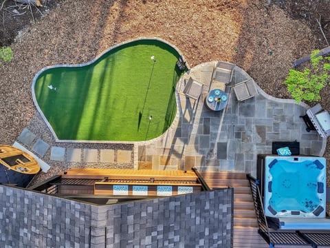 Your private backyard playground—mini golf, hot tub, sauna, outdoor grill, and lounge seating for endless fun and relaxation.