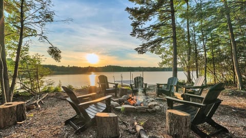 Fire pit by the private dock—perfectly set for cozy evenings, sunset views, and unforgettable lakeside moments.