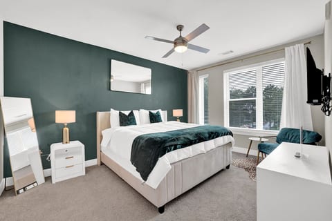 Elegant king bedroom designed for restful nights and relaxing mornings.