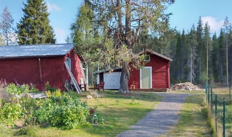 Cozy red cabin surrounded by nature