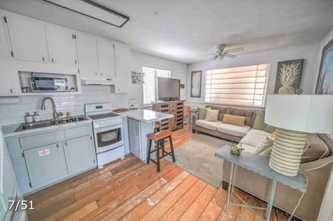 Open concept with living room and kitchen. Smart TV in living room.
