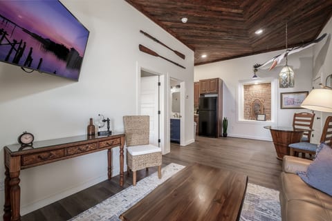 Living and dinette area. Living Space features gorgeous refinished and repurposed wood ceilings.