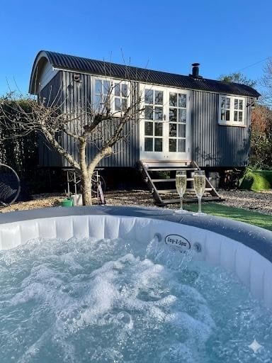 Shepherds hut with hot tub in a private paddock. image 1