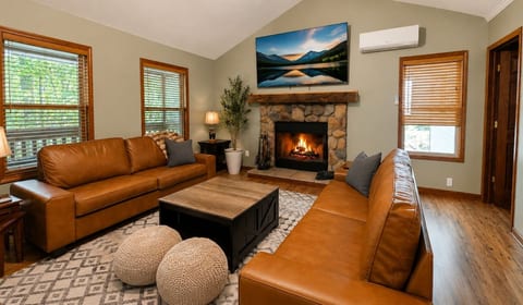 In the living room you can relax on the comfortable couches with a good movie on a 75" Roku TV or challenge each other with a little friendly competition of board games or some conversation. Enjoy the ambience of the wood fireplace.