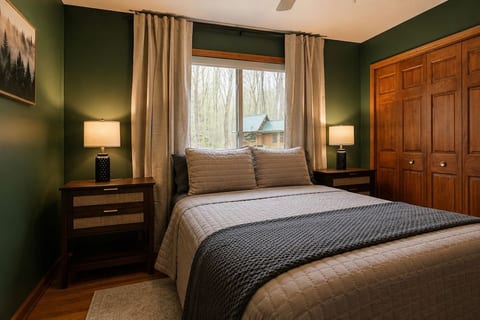 The second bedroom features a queen bed, with plenty of storage space in the closet, bedside charging tables with lamps, Roku tv and an a office desk. Attached to the 2nd bedroom is a bonus room for additional sleeping arrangements.